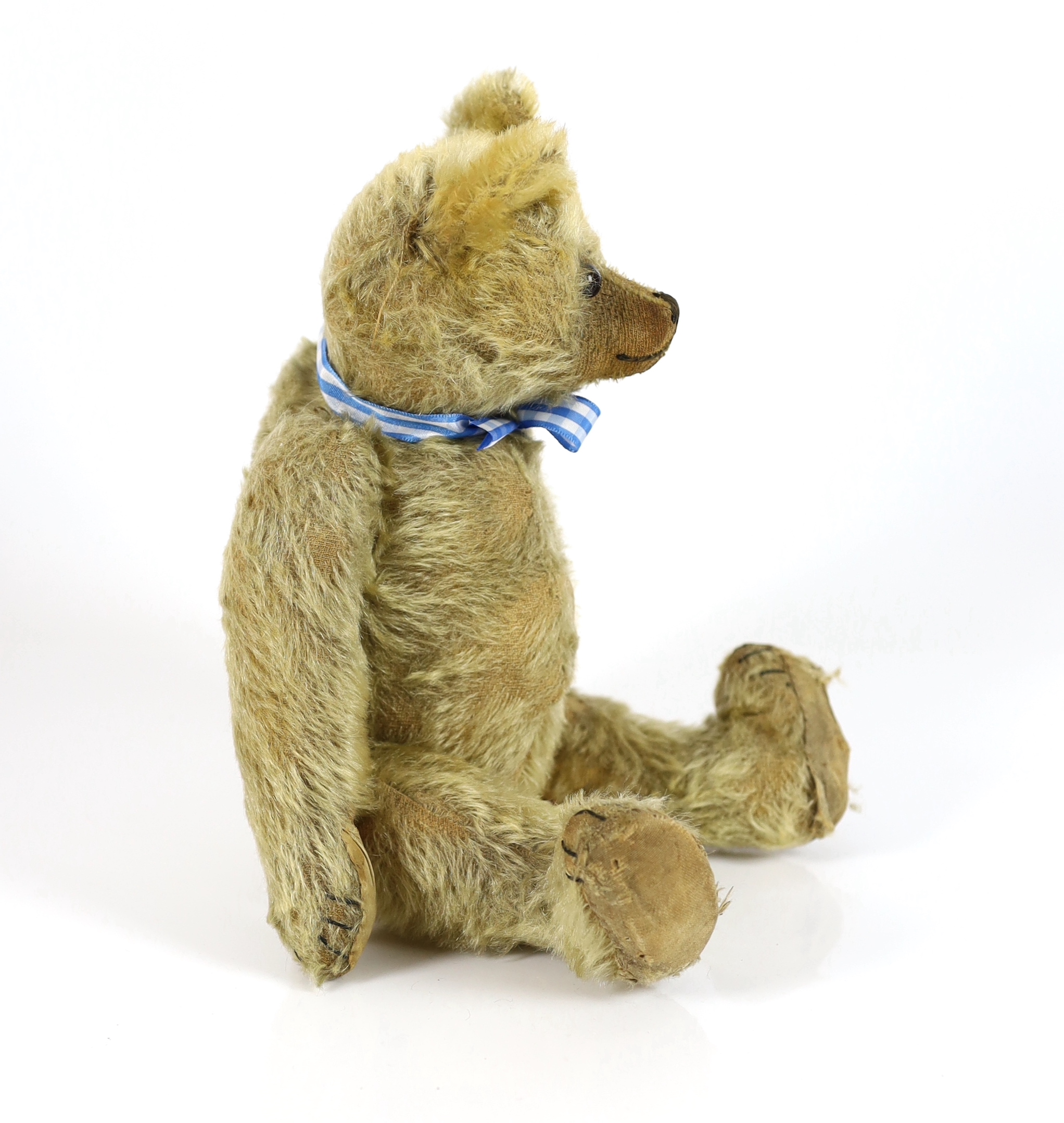 A Farnell bear, c.1912, 33cm, bear paw pads restored, hair loss to stomach